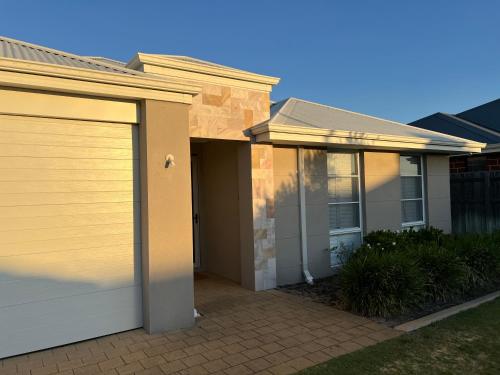 a house with a garage at Garrison Cottage in The Vines