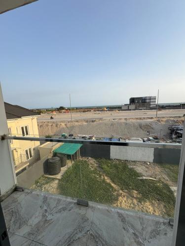 a view from the balcony of a building with a picnic table at 2bedroom luxury apartment in Lekki