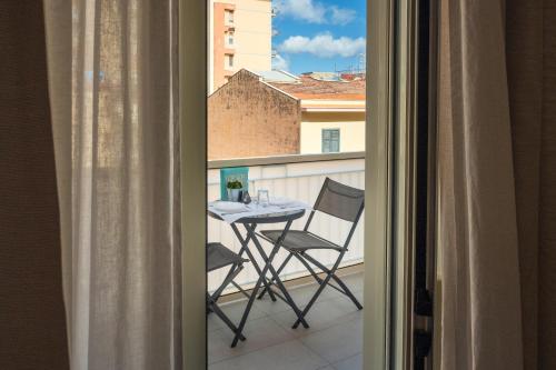 a view of a table and chairs on a balcony at Ciccio Rooms and breakfast - Self check-in in Palermo