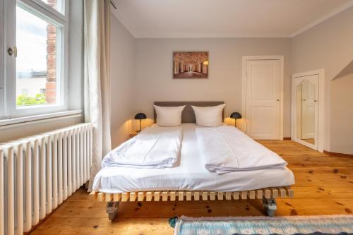 Una cama o camas en una habitación de Design Apartments - "Im Holländerhaus"