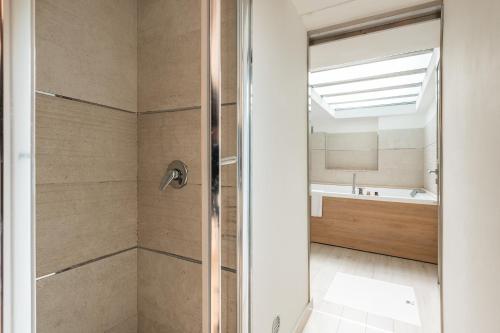 a bathroom with a shower and a sink at Karalis Relais in Cagliari