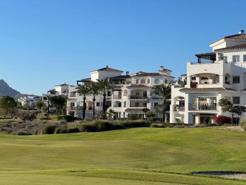 a view of the golf course at a resort at Charming apartment with a pool and golf view in Sucina