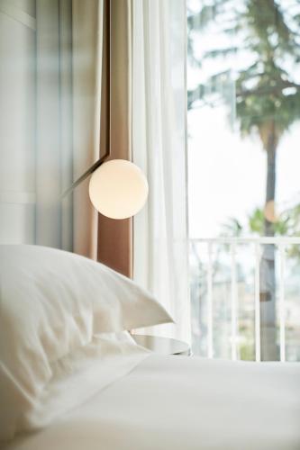 De Bonart Naples, Curio Collection By Hiltonにあるベッド