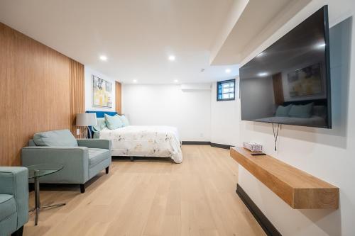 a living room with a bed and a couch at Tranquil 2bedroom basement in charming Mississauga in Mississauga