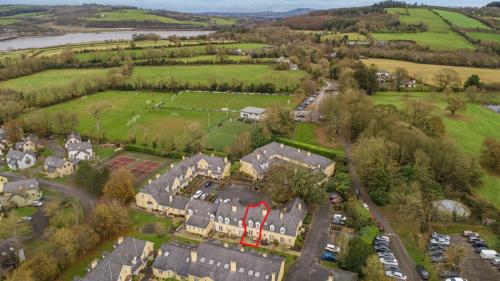 an aerial view of a house with a tennis court at Faithlegg Mews, Faithlegg in Waterford