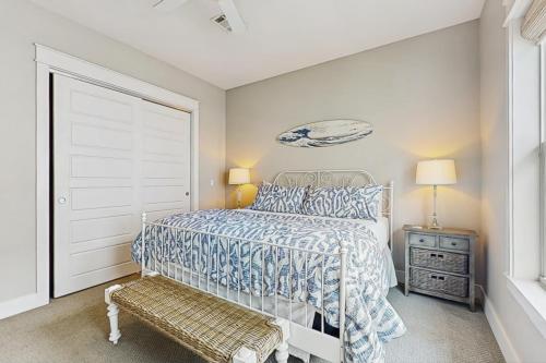 a white bedroom with a bed and a window at No Time to Worry in Rockport