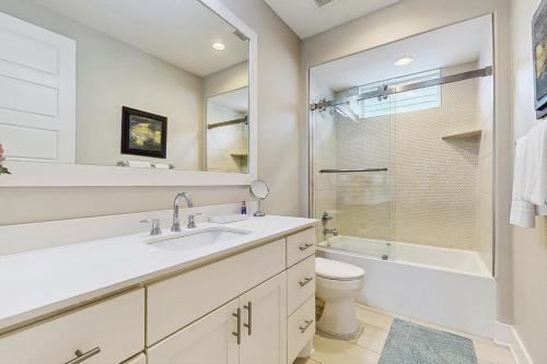 a bathroom with a sink and a toilet and a shower at No Time to Worry in Rockport