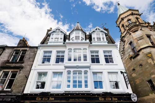 a large white building with a clock tower at Stylish 2-Bed Apartment in the Heritage Quarter in Dunfermline