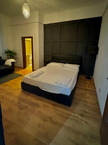 a bedroom with a large bed in a room at ApartHotel Verona Centro in Verona