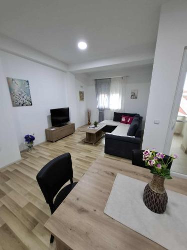 a living room with a couch and a table at Apartments Josif in Gevgelija