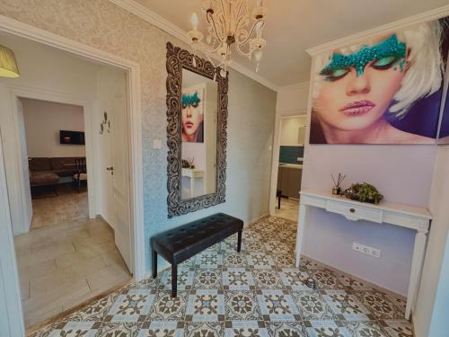 a hallway with a mirror and a bench in a room at Azur Villa - Panoramic Escape in Balatonalmádi