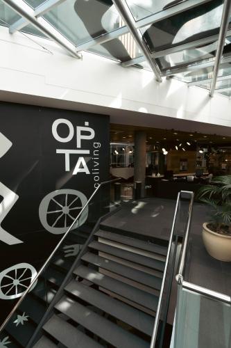 a staircase in a building with a sign on the wall at Opta Coliving Punta Carretas in Montevideo