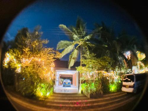 a house with christmas lights in front of it at Paradise Itzu in Kandy
