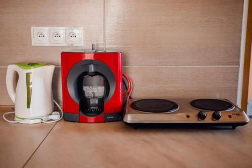 a coffee maker and a toaster sitting on a counter at Apartmán Pod Žalým in Benecko