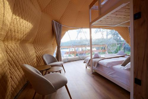 Voodi või voodid majutusasutuse Glamping Trhovky toas