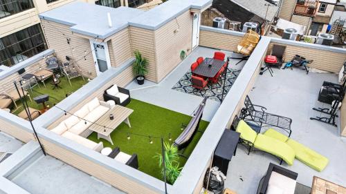 an overhead view of a backyard with a patio with furniture at Brand New Dbl Unit Roofdeck Outdoor Patio in Philadelphia