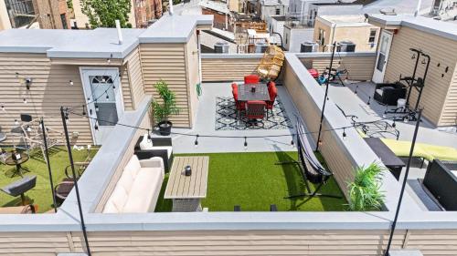 an aerial view of a house with a backyard at Brand New Dbl Unit Roofdeck Outdoor Patio in Philadelphia