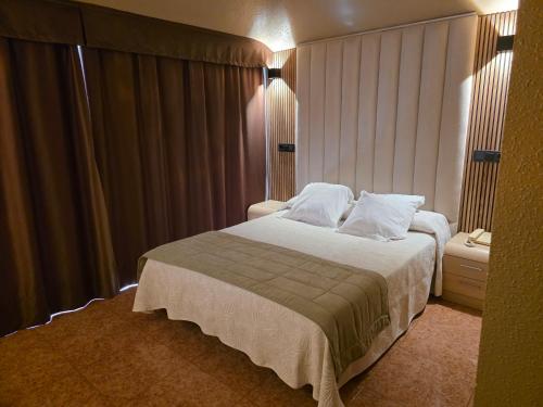 Postel nebo postele na pokoji v ubytování Hotel Gala