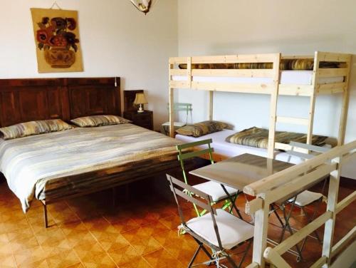 Una cama o camas en una habitación de La Corte del Borgo