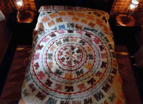 a pillow with a pattern on it sitting on a table at Pousada Romântica Serra da Mata in Penedo