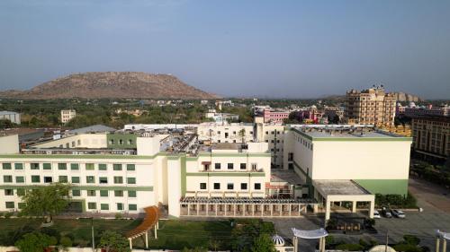 a city with buildings and a mountain in the background at The Sky Imperial, Jaipur in Jaipur