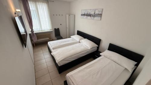 Katil atau katil-katil dalam bilik di Hotel San Carlo
