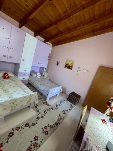 Postel nebo postele na pokoji v ubytování Villa Theodora