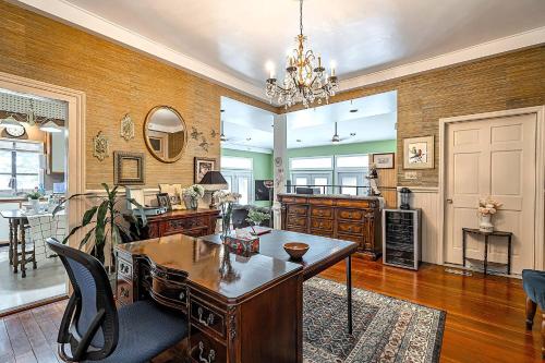 a living room with a table and a dining room at Master King Room Victorian with Private Bathroom in a Historic house in Savannah