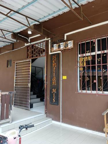 a building with a sign on the side of it at Perhentian MJ Fisherman Village in Perhentian Island