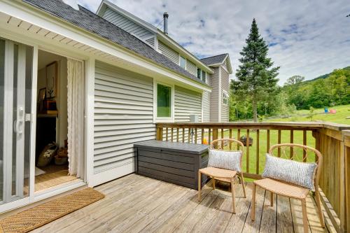 a patio with two chairs and a table on a deck at Ski-InandSki-Out Magic Mountain Condo with Deck! in Londonderry