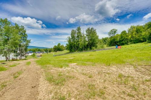an open field with trees and a dirt road at Ski-InandSki-Out Magic Mountain Condo with Deck! in Londonderry