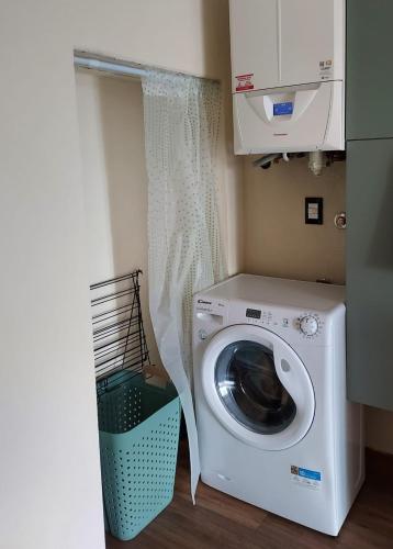 a washer and dryer in a laundry room at Pasubio 13 in Selvino