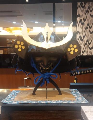 a mask with a skull and horns on a table at APA Hotel Keikyu Kamata Ekimae Nishi in Tokyo