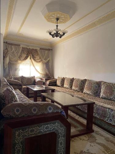 a living room with a couch and a table at Souhail house in Chefchaouen