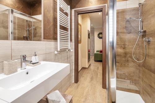 a bathroom with a sink and a shower at ROMAN DREAM I in Rome
