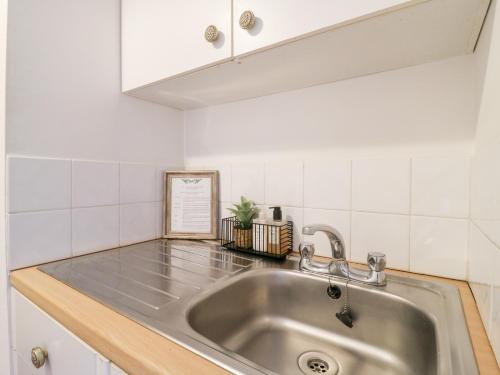 a kitchen counter with a sink in a kitchen at BB House in Bedford