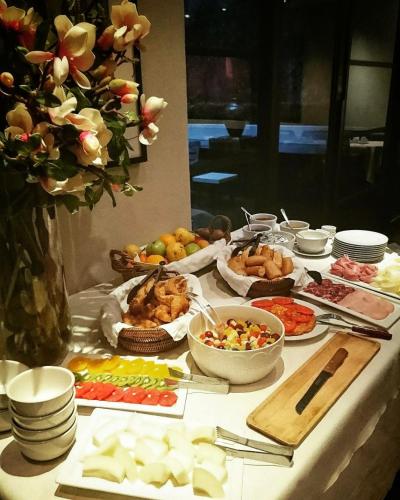 a table with many different types of food on it at Libertad Hotel Buenos Aires in Buenos Aires