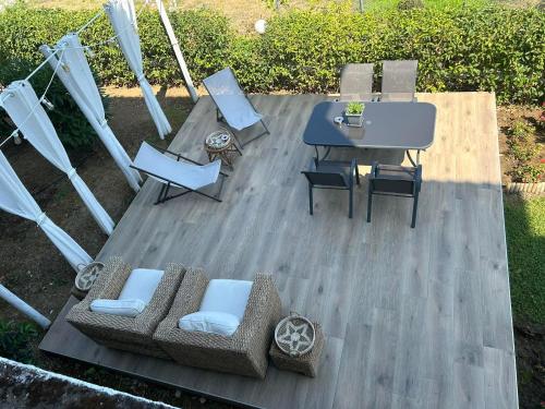 an aerial view of a patio with a table and chairs at La Casa Tzortzina in Kókkinon Nerón