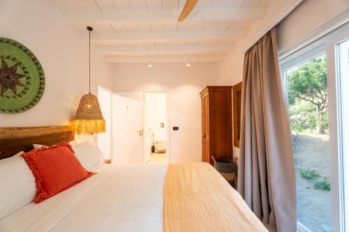 a bedroom with a bed and a large window at Villa Zina Sunset View St Lazaros 7 plus 1 Bedroom in Psarou