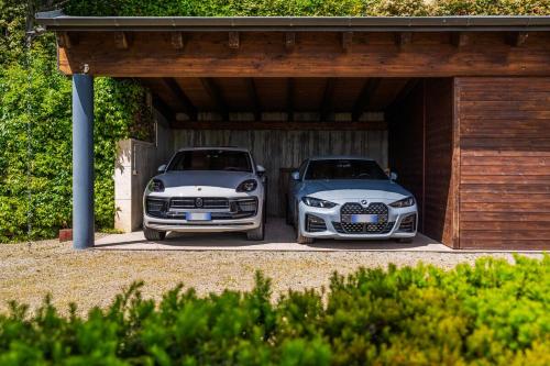two cars are parked in a garage at Residenza Storica sulle Colline di Maranello in Fogliano