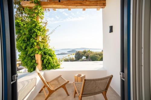 a room with a view of the ocean at Villa Zina Sunset View St Lazaros 7 plus 1 Bedroom in Psarou