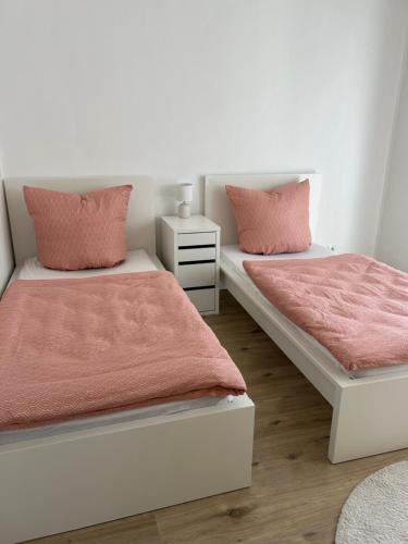 Postel nebo postele na pokoji v ubytování Ferienwohnung - Am Eisenberg