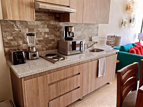 a kitchen with a counter top with a blender on it at Departamento para Vacacionar in Chantepec