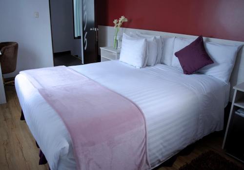 Postel nebo postele na pokoji v ubytování Dreams Hotel Boutique