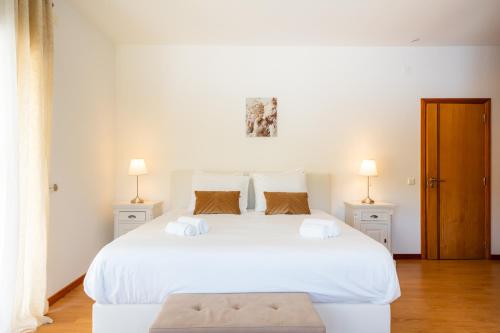 Ένα ή περισσότερα κρεβάτια σε δωμάτιο στο Villa Moinhos da Costa