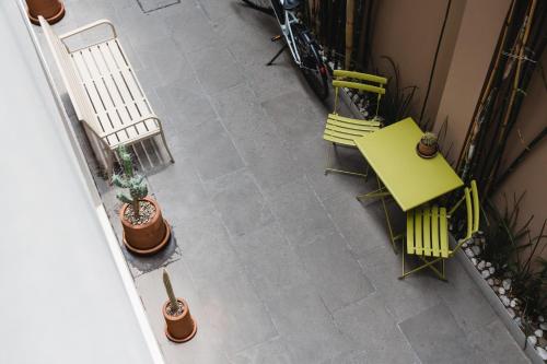 an overhead view of a patio with a table and chairs at The Gallery in Mexico City