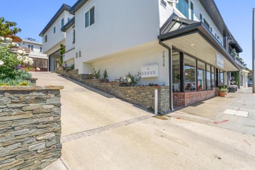 an empty street in front of a building at Penthouse Steps from Victoria Beach 180 degree ocean views in Laguna Beach