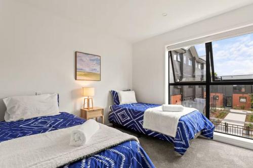 Ένα ή περισσότερα κρεβάτια σε δωμάτιο στο Vibrant 2 bed Henderson Abode