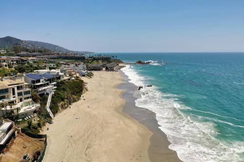 an aerial view of a beach with houses and the ocean at Ocean VIEWS Steps from Victoria Beach Lux Design in Laguna Beach