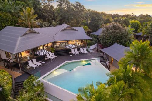 an aerial view of a house with a swimming pool at Tranquil Byron Bay Villa, Hinterland views - Vue 5 in Ewingsdale
